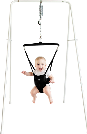 Baby happily jumping in jolly jumper