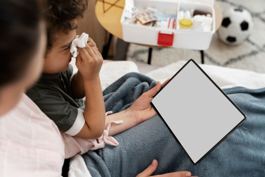 Child with mom looking at an iPad