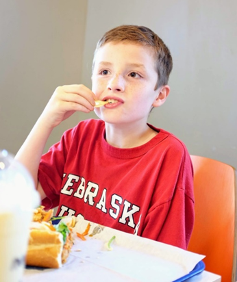 Young boy eating food
