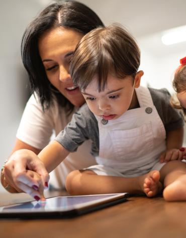 mom and young boy with ipad