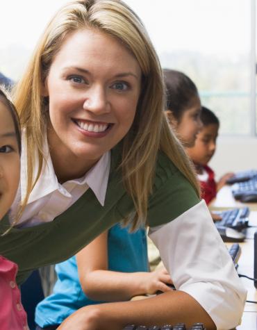 child and adult in school environment