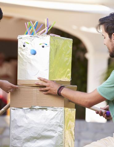 dad and son building a robot