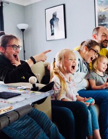 Family enjoying Nintendo Switch game