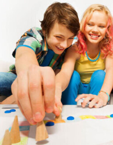 teens playing board game