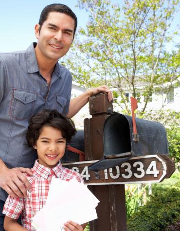 Parent and child checking mail box
