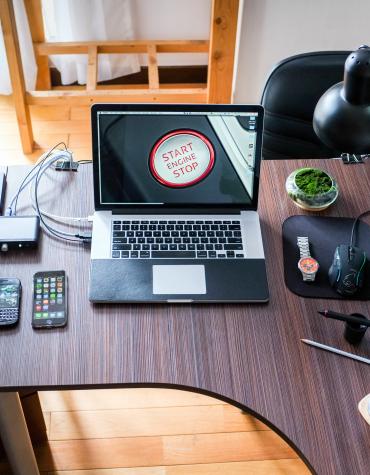 Desk filled with information technology devices 