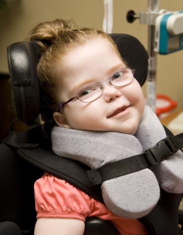 young girl with glasses in clinic setting