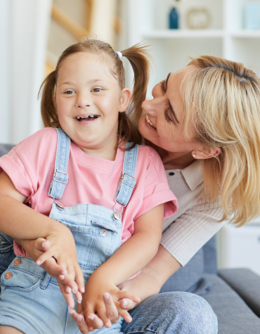 Adult hugging child