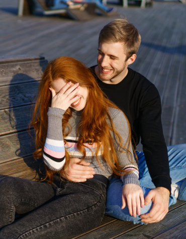 teen boy and girl sitting together