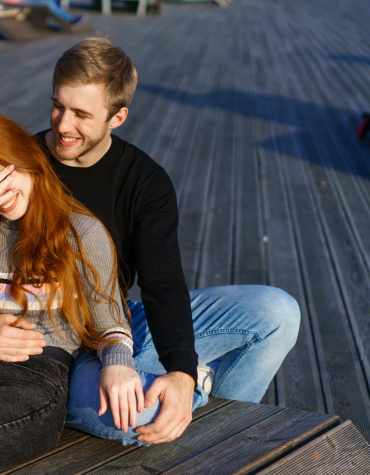 teen boy and girl sitting together
