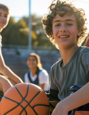 kid in wheelchair with basketball