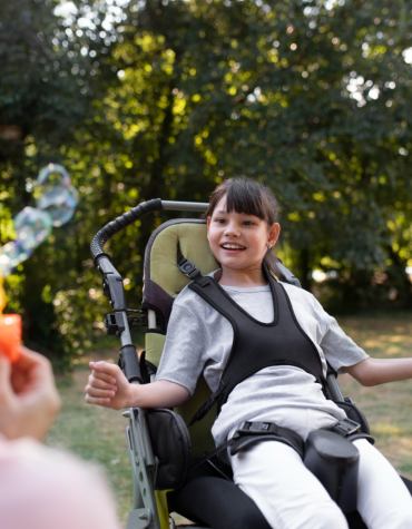 girl in wheelchair, bubbles