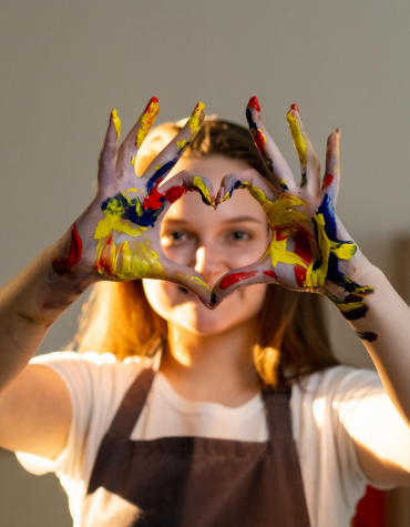 Teen with paint on hands