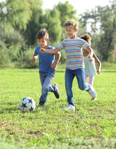 kids kicking a ball