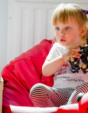 small girl with stuffed animal