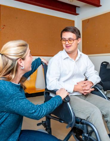 adult in wheelchair talking