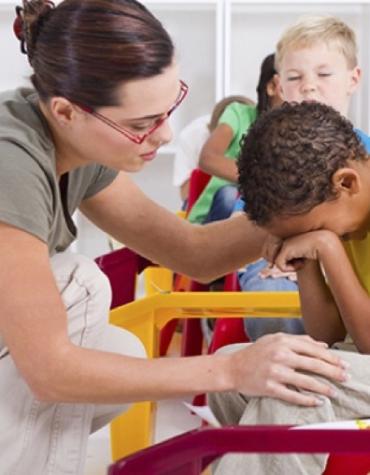 adult helping a child