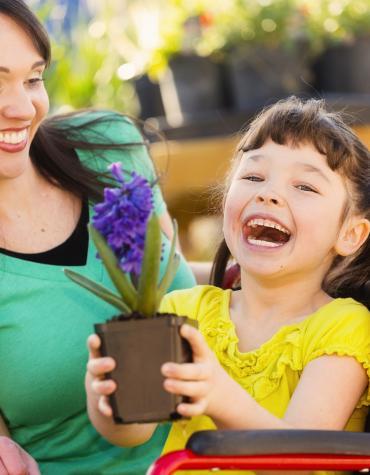 Smiling child with plant