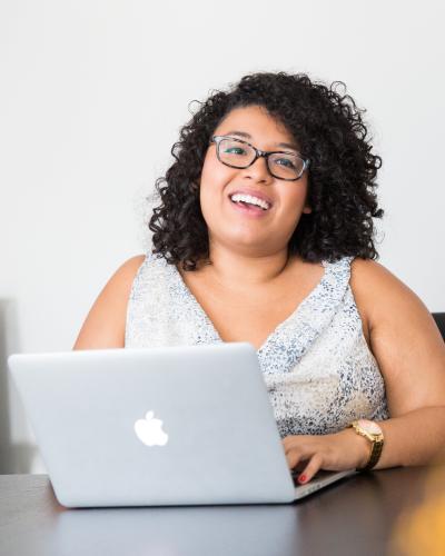 Smiling person on computer